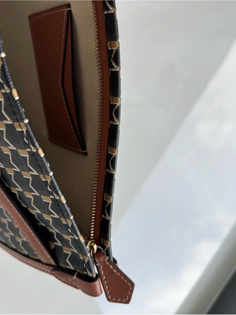 Moynat M Nomad Pouch (brown M monogram canvas with leather trim and wrist strap)